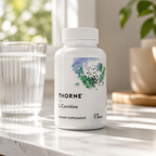 Thorne L-Carnitine 330 mg 60 capsules lifestyle setting with water