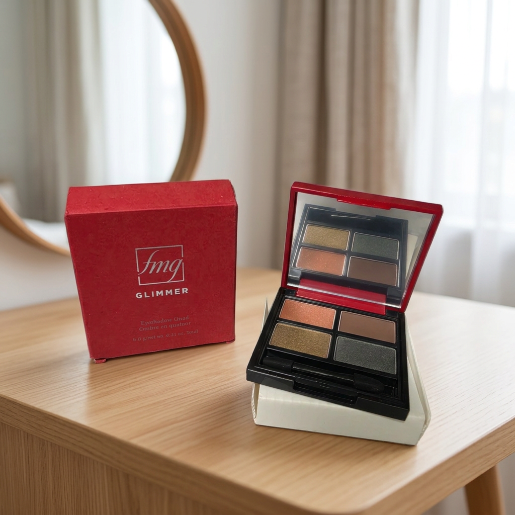 Avon fmg Glimmer Siren four-shade eyeshadow quad and red box on a vanity, AI-assisted lifestyle scene.