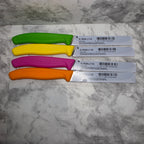 Actual label side of four Victorinox Swiss Classic knives showing individual model numbers and barcodes