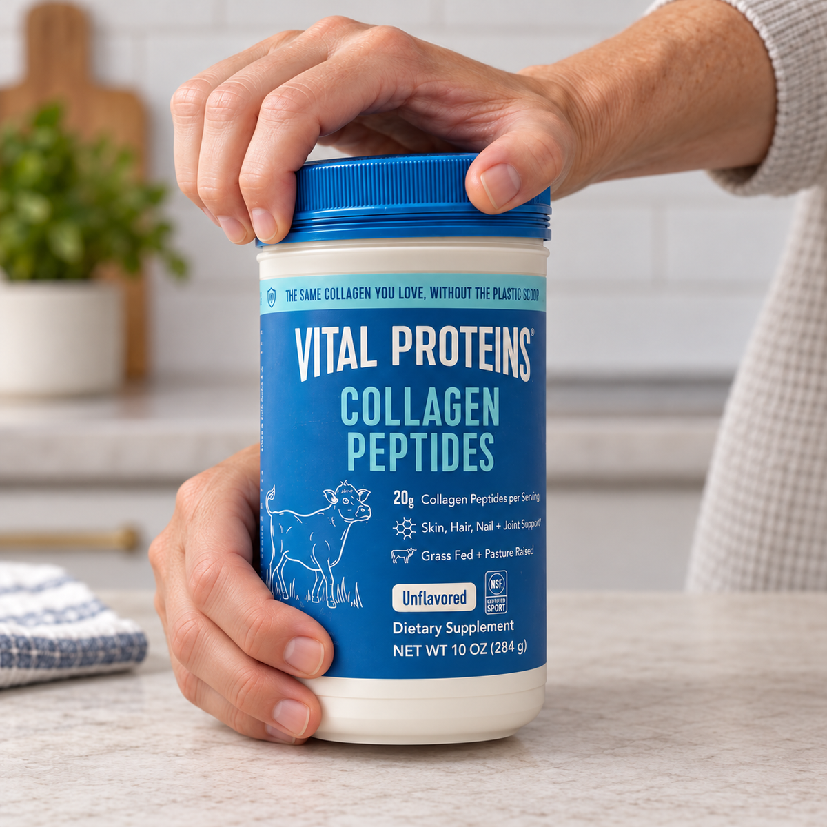 Adult opening one Vital Proteins Collagen Peptides 10 oz tub