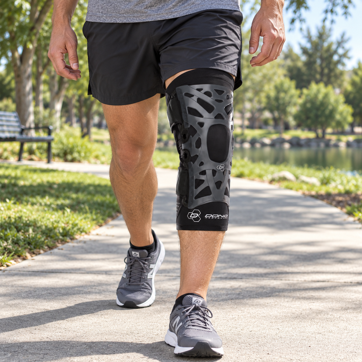 Walking along a neighborhood path wearing the DonJoy Webtech knee brace