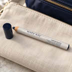 Mary Kay Weekender Classic Navy eye pencil and cap on a cream travel pouch