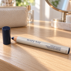 Mary Kay Weekender Classic Navy eye pencil and cap on a sunlit wooden vanity
