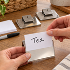 AI-generated illustration of a Tea label card being inserted into a Whitmor label clip; baskets, bins and background props not included.