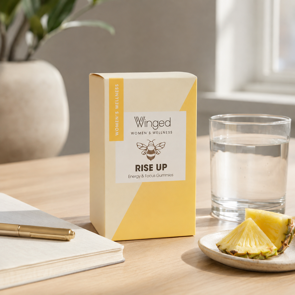 AI-generated context image of Winged Wellness Rise Up pineapple gummies on a clean desk with water