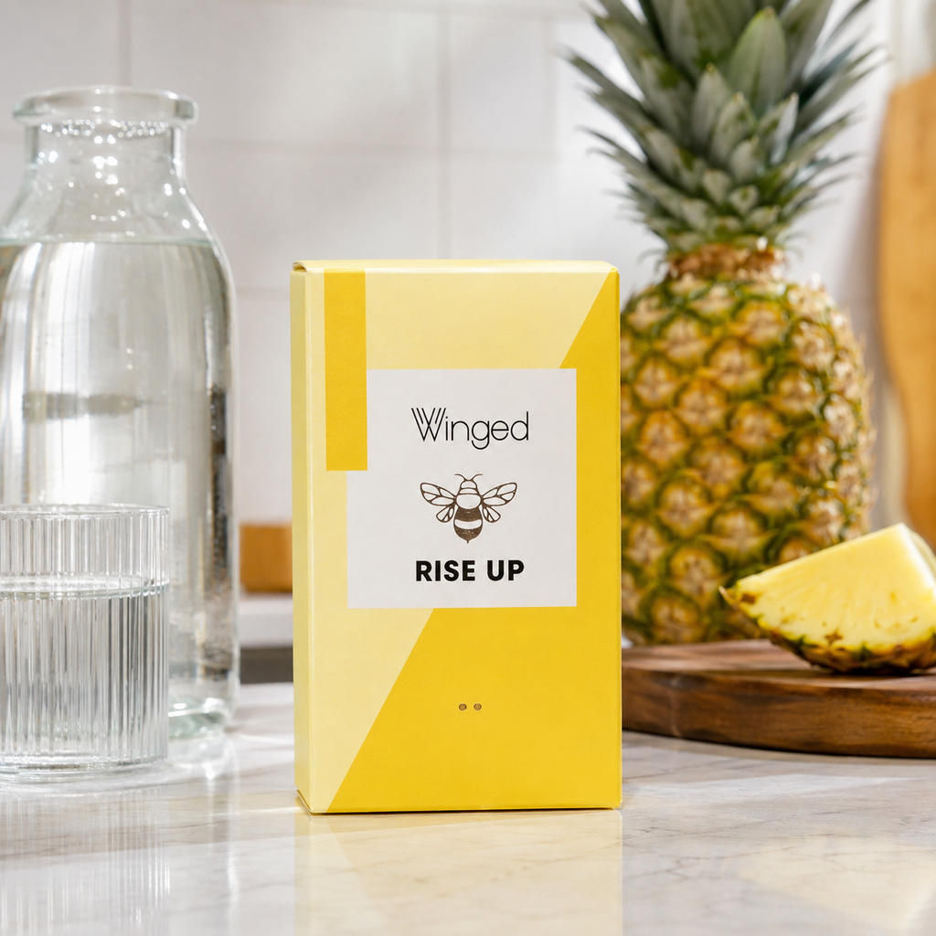 AI-generated context image of Winged Wellness Rise Up pineapple gummies with water and pineapple on a kitchen counter