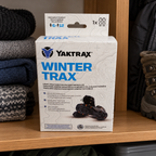 AI-generated lifestyle illustration of one closed Yaktrax WinterTrax package on a gear shelf. Background props not included.