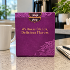 AI-generated lifestyle scene of the closed purple Yogi tea sampler box on a office tea counter. Props not included.