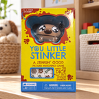 AI-generated lifestyle illustration of the closed You Little Stinker dog dice game box on a playroom shelf