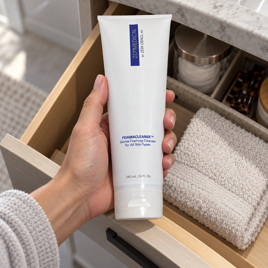 Adult taking ZO Medical Foamacleanse 240 mL from a bathroom drawer