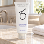 AI-generated lifestyle scene of ZO Skin Health Hydrating Cleanser 200 mL / 6.7 fl oz on a limestone vanity beside a washcloth.